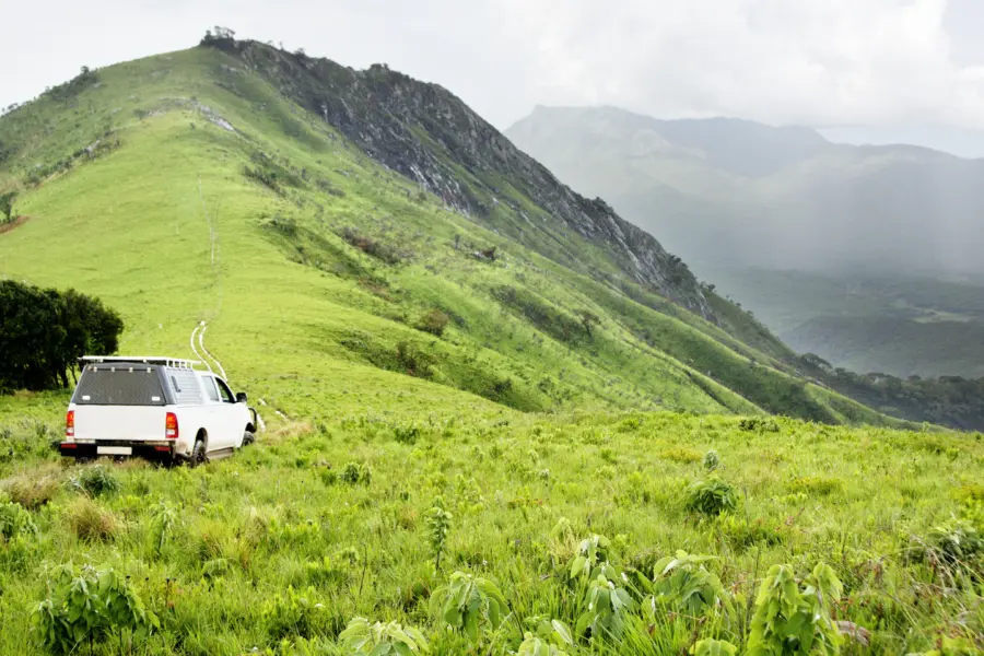 Avila Reizen Malawi Vehicle in Rainy Weather at Jalawe Rock Nyika Plateau Malawi