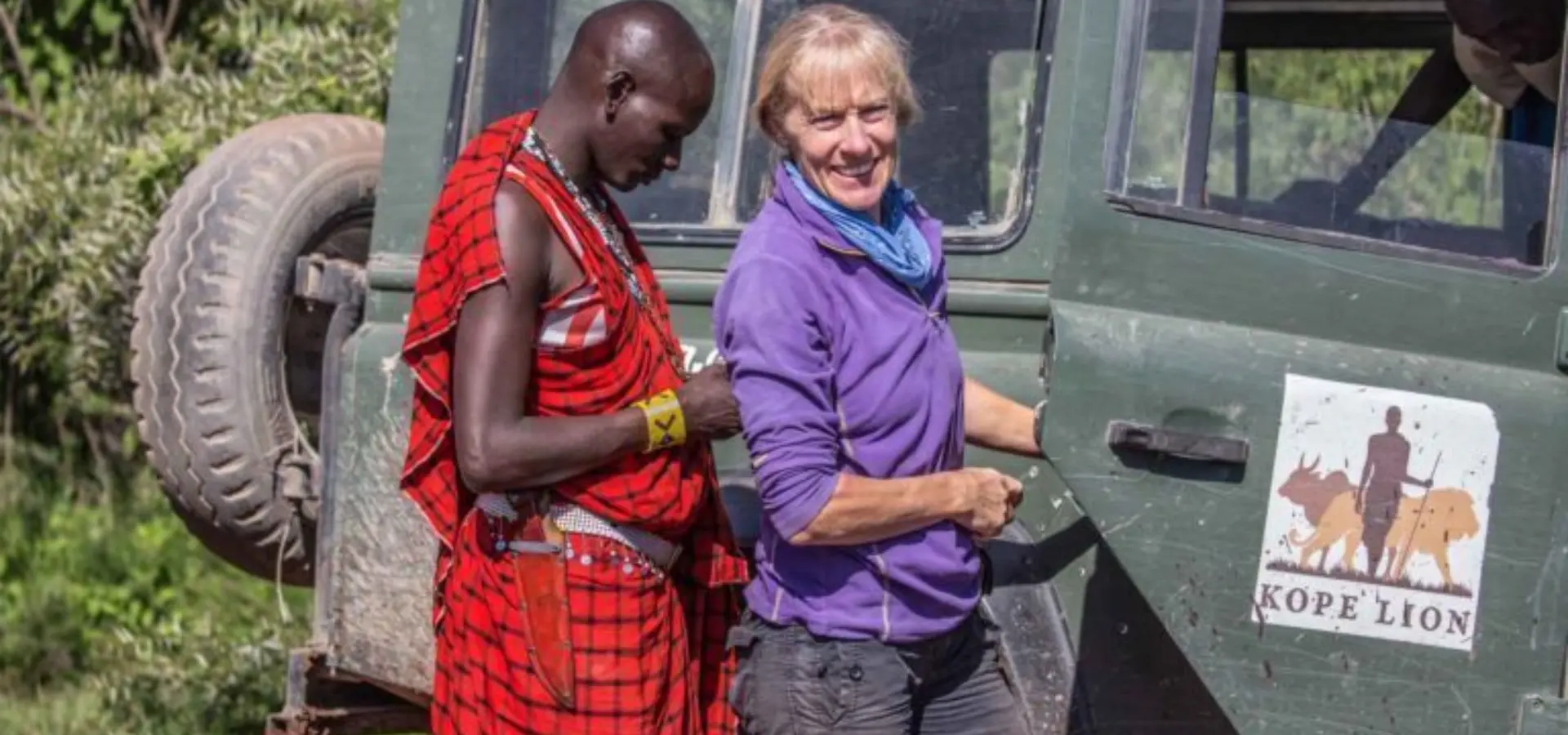 11 lion researcher mama simba and maasai ilkochuti next to research vehicle 768x432