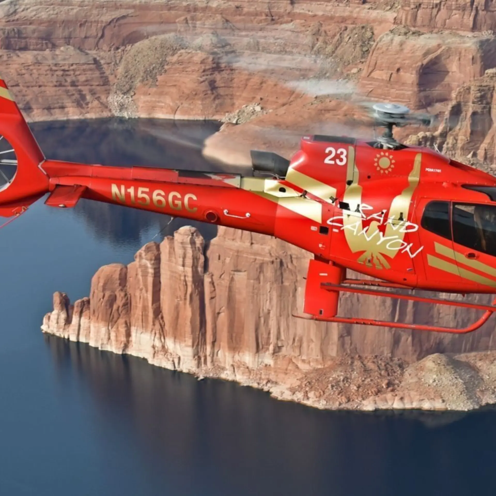 Rs13659 rs9411 pap1 lakemead edit red ec 130 helicopter flying over lake mead