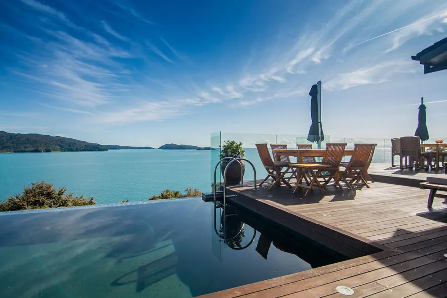 Luxury accommodation new zealand split apple retreat infinity pool and terrace