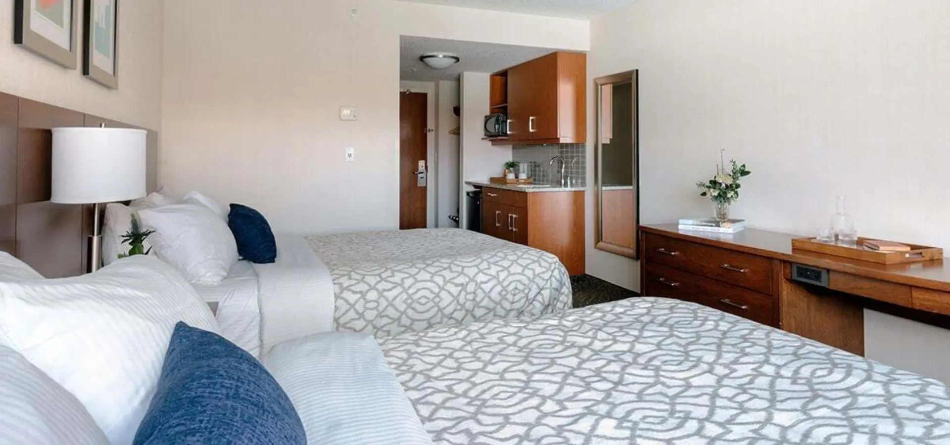 1782717468524 gi two beds hotel room