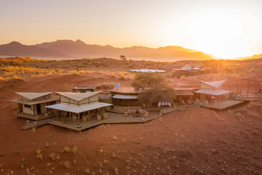 1736924264106 WOLWEDANS COLLECTION Dune Camp Main area at sunset